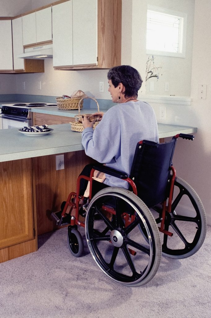elderly woman sitting in a lightweight wheelchair